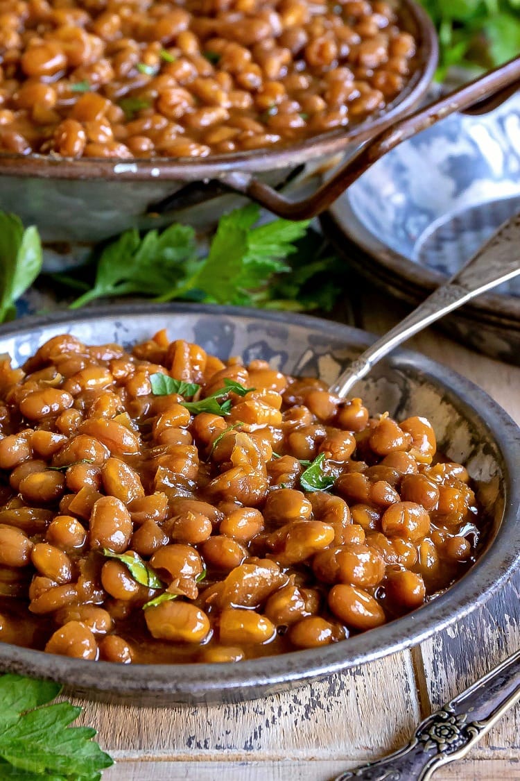 baked beans in antique silver bowl