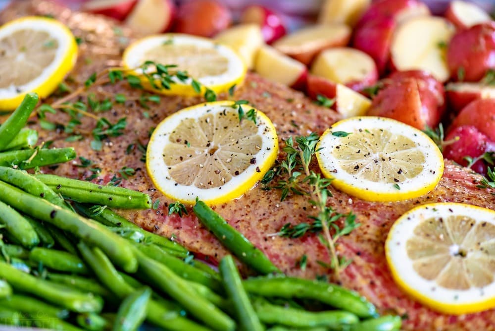 baked salmon honey dijon glaze with green beans and red potatoes on sheet pan