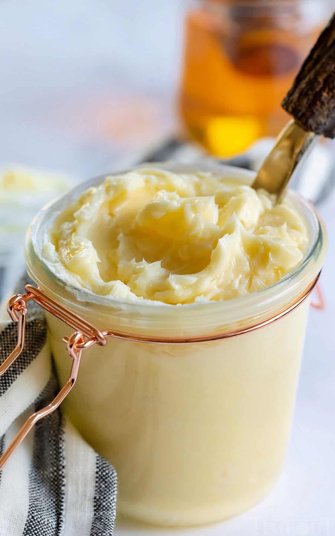 honey butter in jar with lid and towel