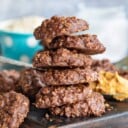 no bake cookies stacked on brown cutting board