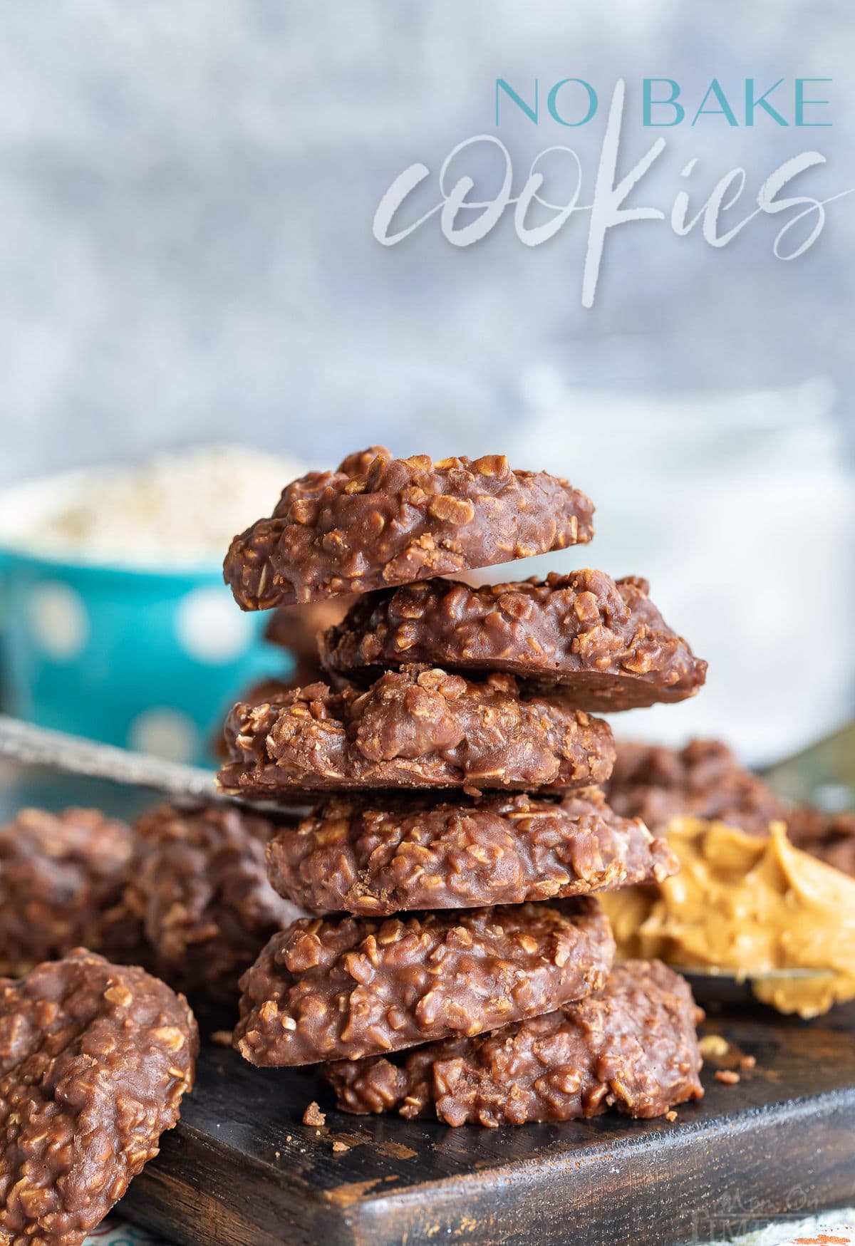 no bake cookies with chocolate oats and peanut butter on a dark cutting board stacked 5 high
