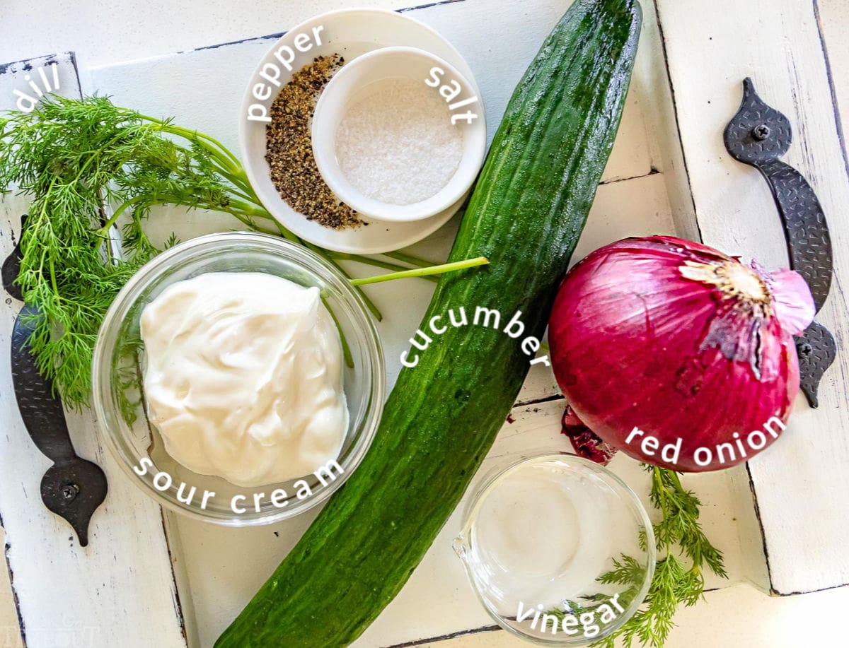 cucumber salad ingredients on a tray