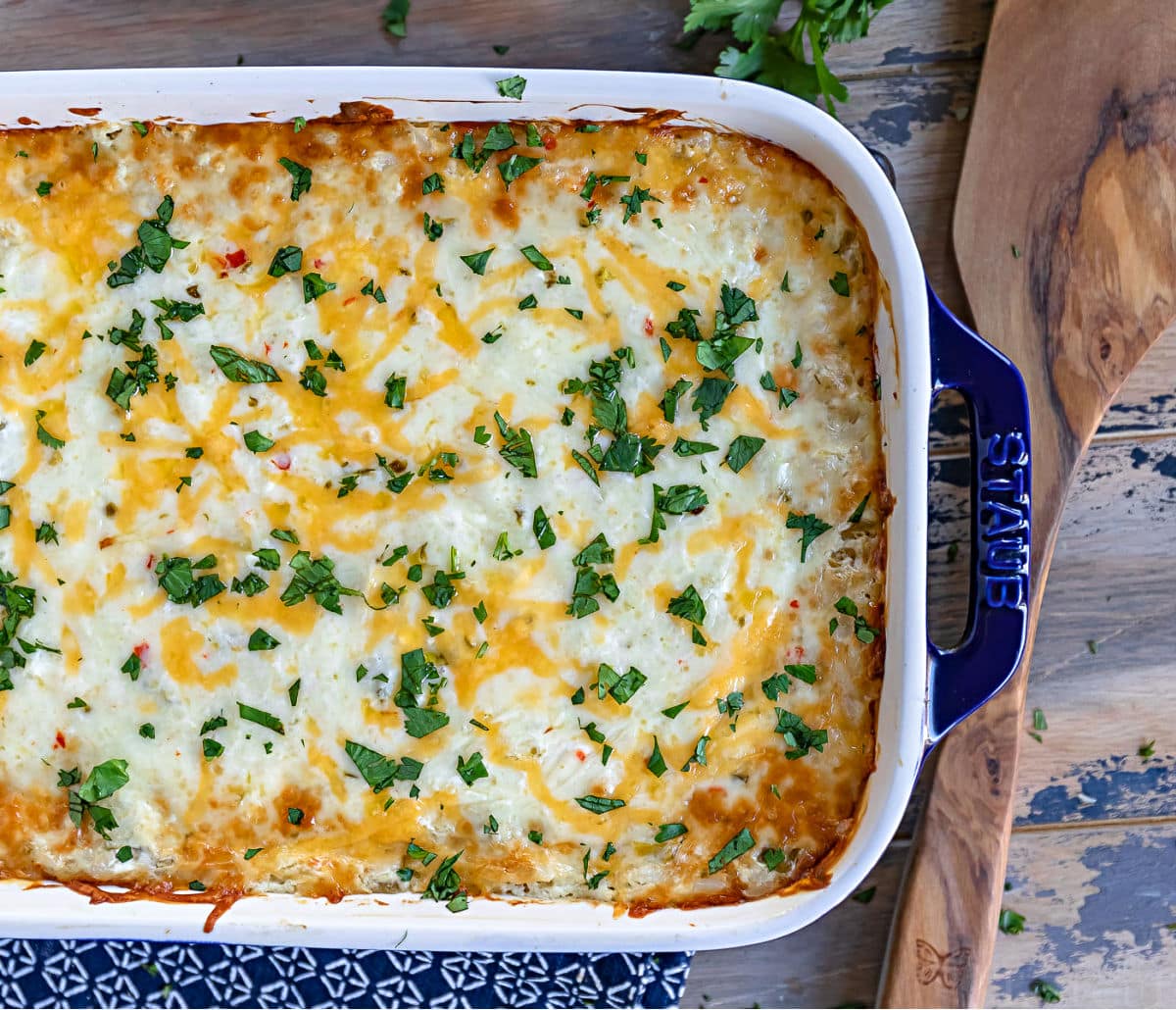 top down view of casserole in baking dish with wood spoon to the side