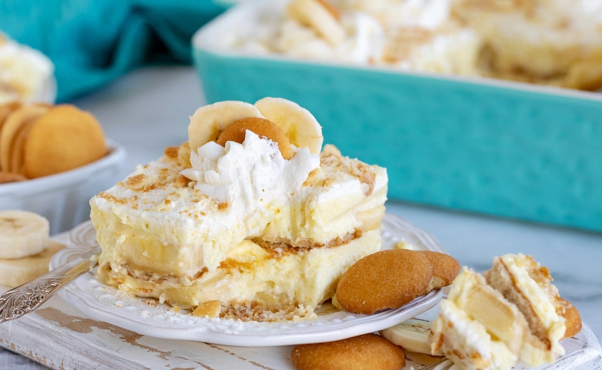 banana pudding recipe sitting on white plate with bite removed with fork still on plate