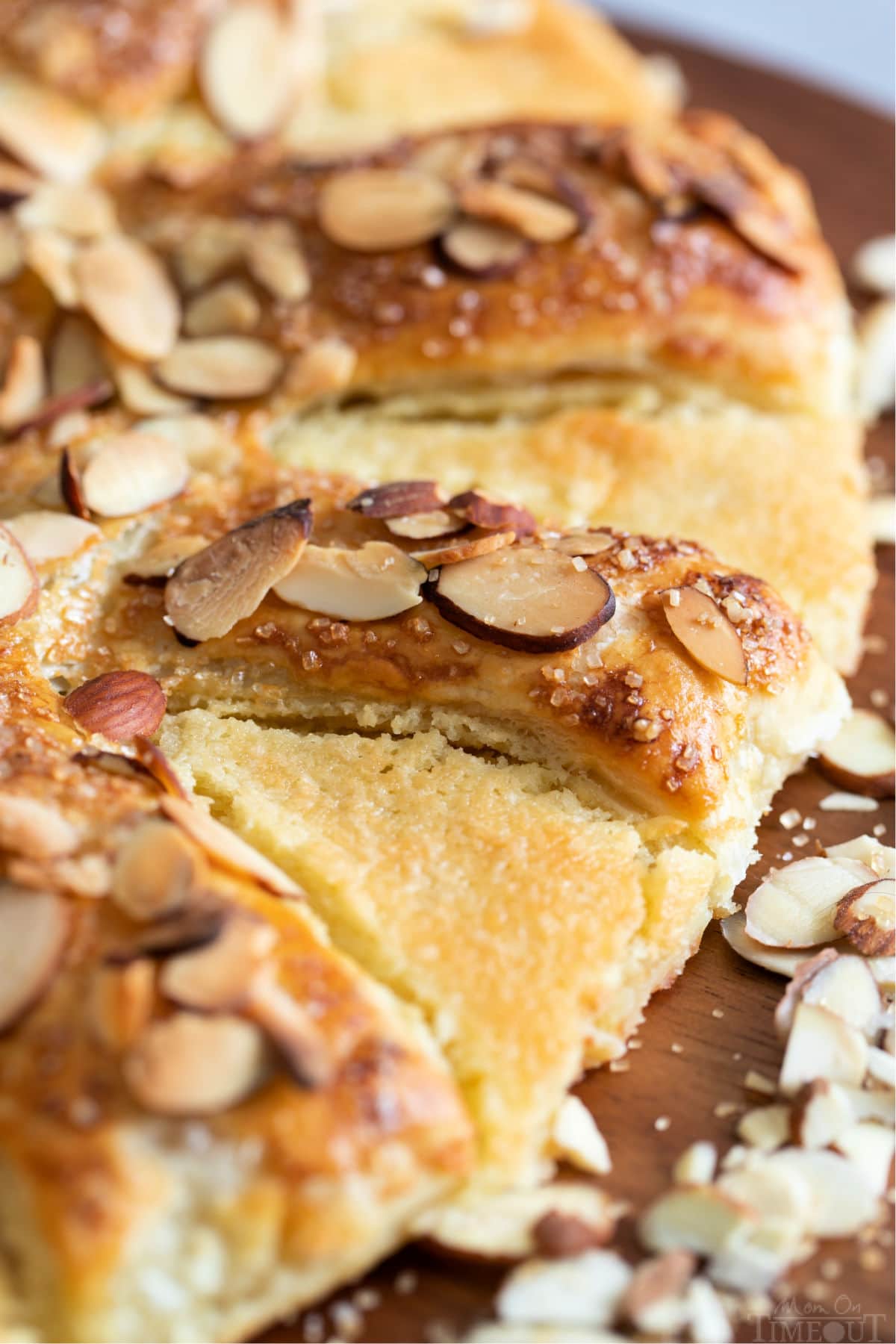 close up of bear claw pastry with almonds on top