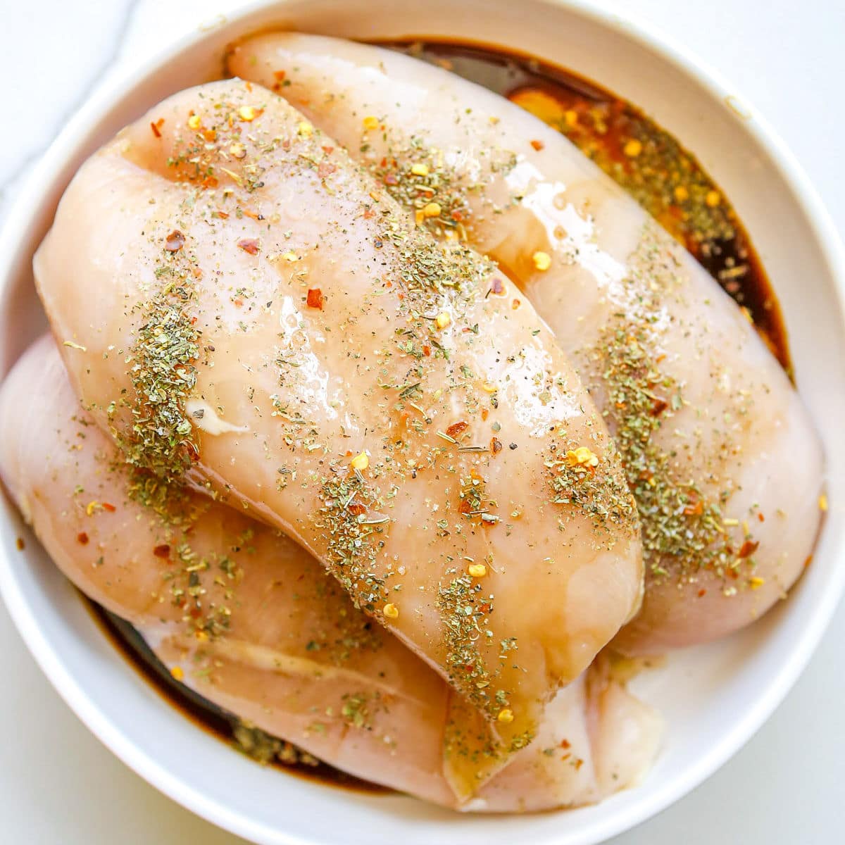 seasoned chicken breasts on white plate