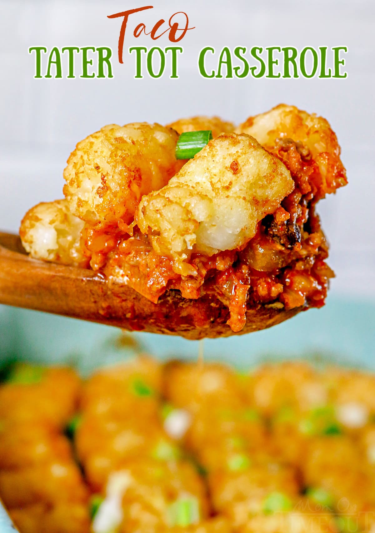 taco tater tot casserole being scooped out of dish with wood spoon with text overlay