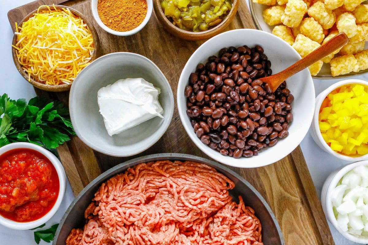 taco tater tot casserole ingredients measured out into bowls