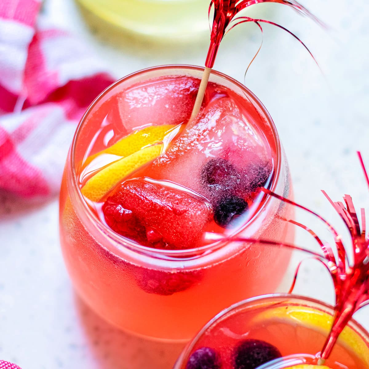 top down view of berry lemonade in wine glasses square