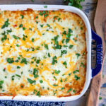 top down view of casserole in baking dish with wood spoon to the side