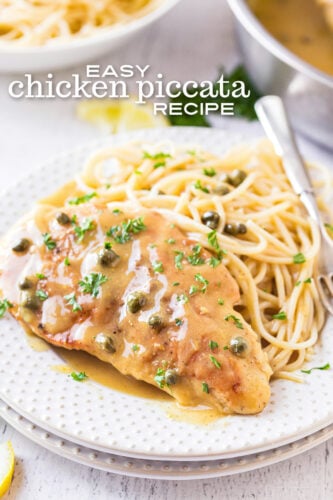 easy chicken piccata recipe plated on a white plate with spaghetti and garnished with parsley