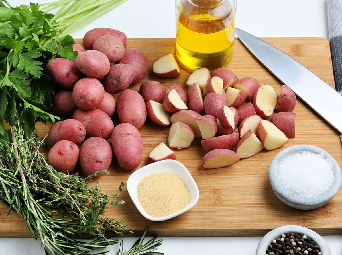 oven roasted potatoes ingredients set out on wood cutting board