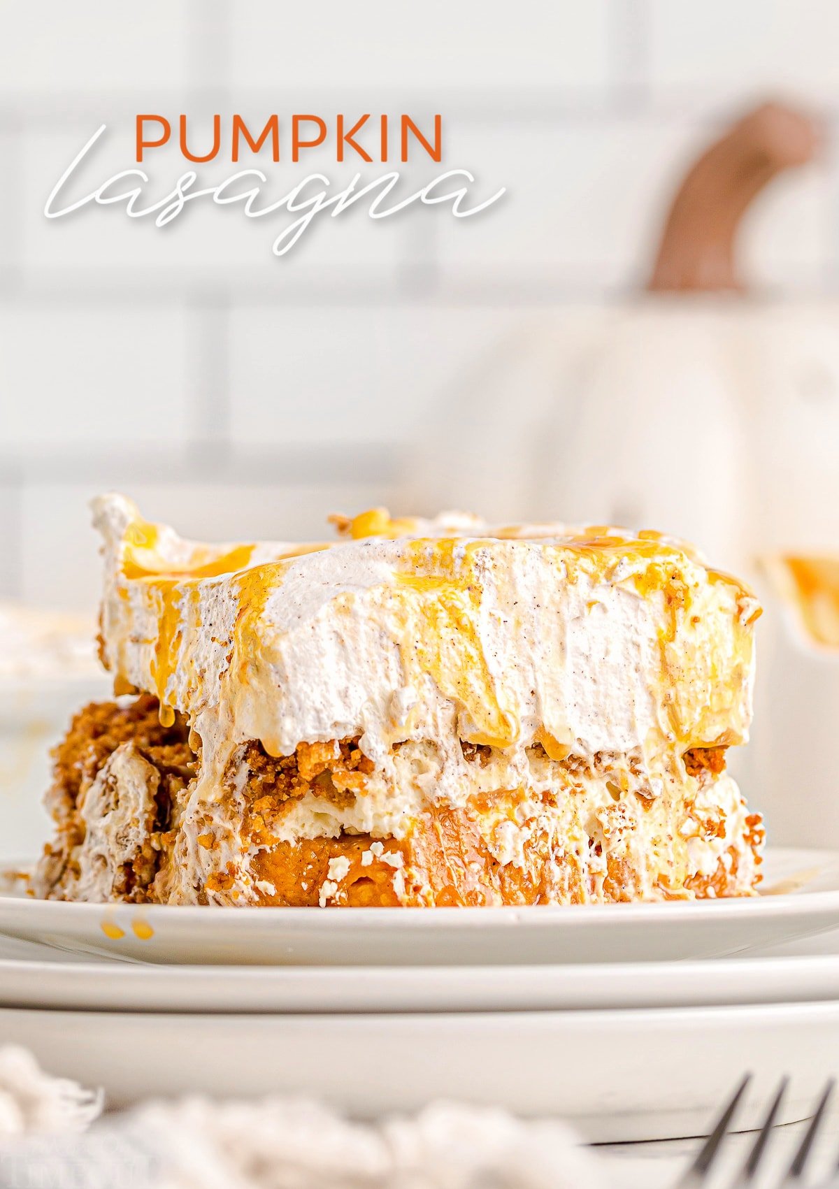 pumpkin dessert sitting on white plates with caramel sauce drizzled over the top and text overlay at the top of the image