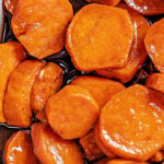 close up of candied yams in baking dish top down view