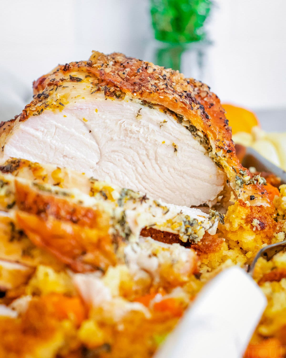 close up of roast turkey breast sliced on sheet pan