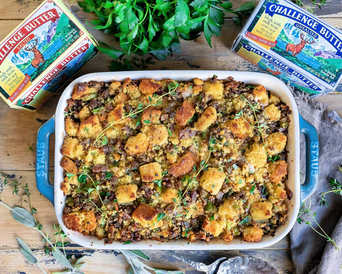 overhead view of cornbread stuffing baked with challenge butter boxes on the side