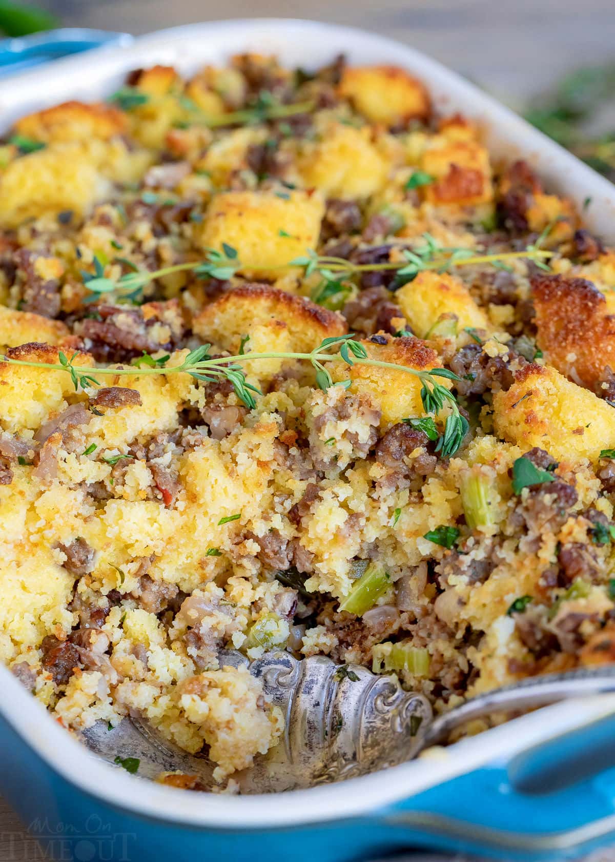 cornbread stuffing with a scoop removed in baking dish