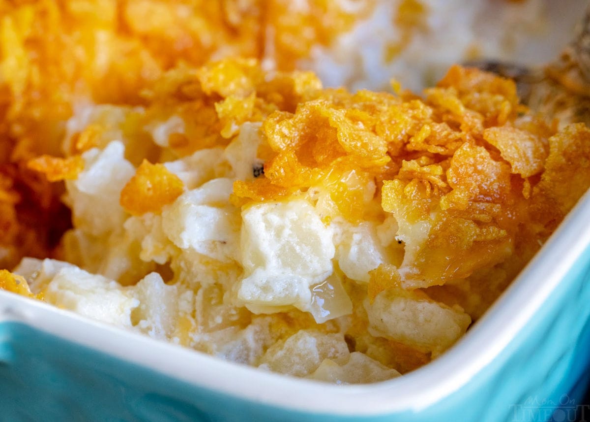 funeral potatoes in casserole dish with cornflake topping