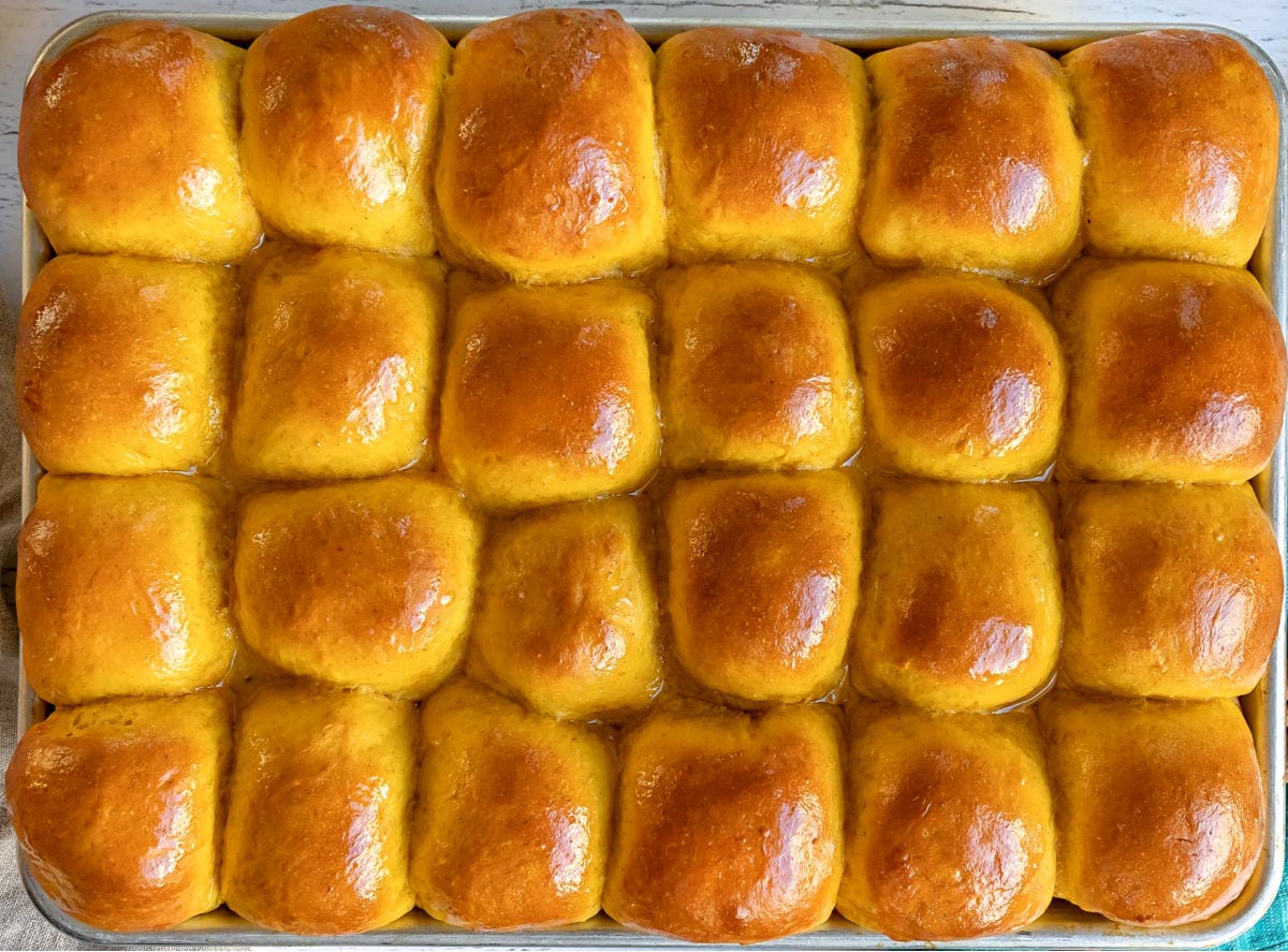 pumpkin rolls baked in sheet pan and brushed with butter