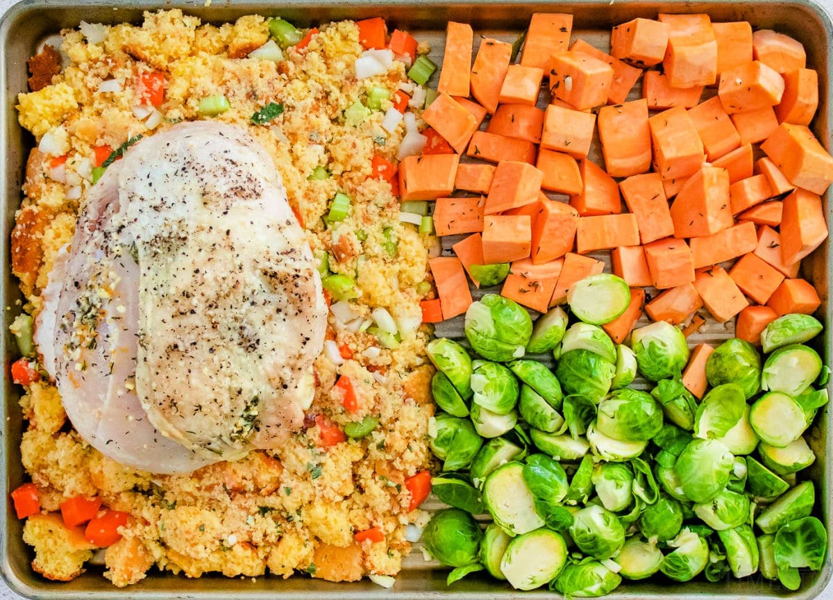 roast turkey breast recipe with sides on sheet pan ready to bake