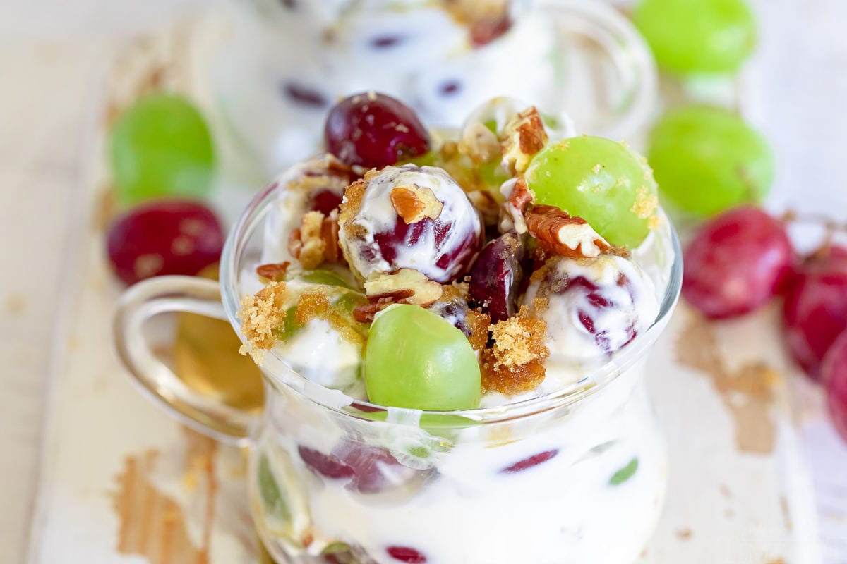 close up look at grape salad in clear small tea cup