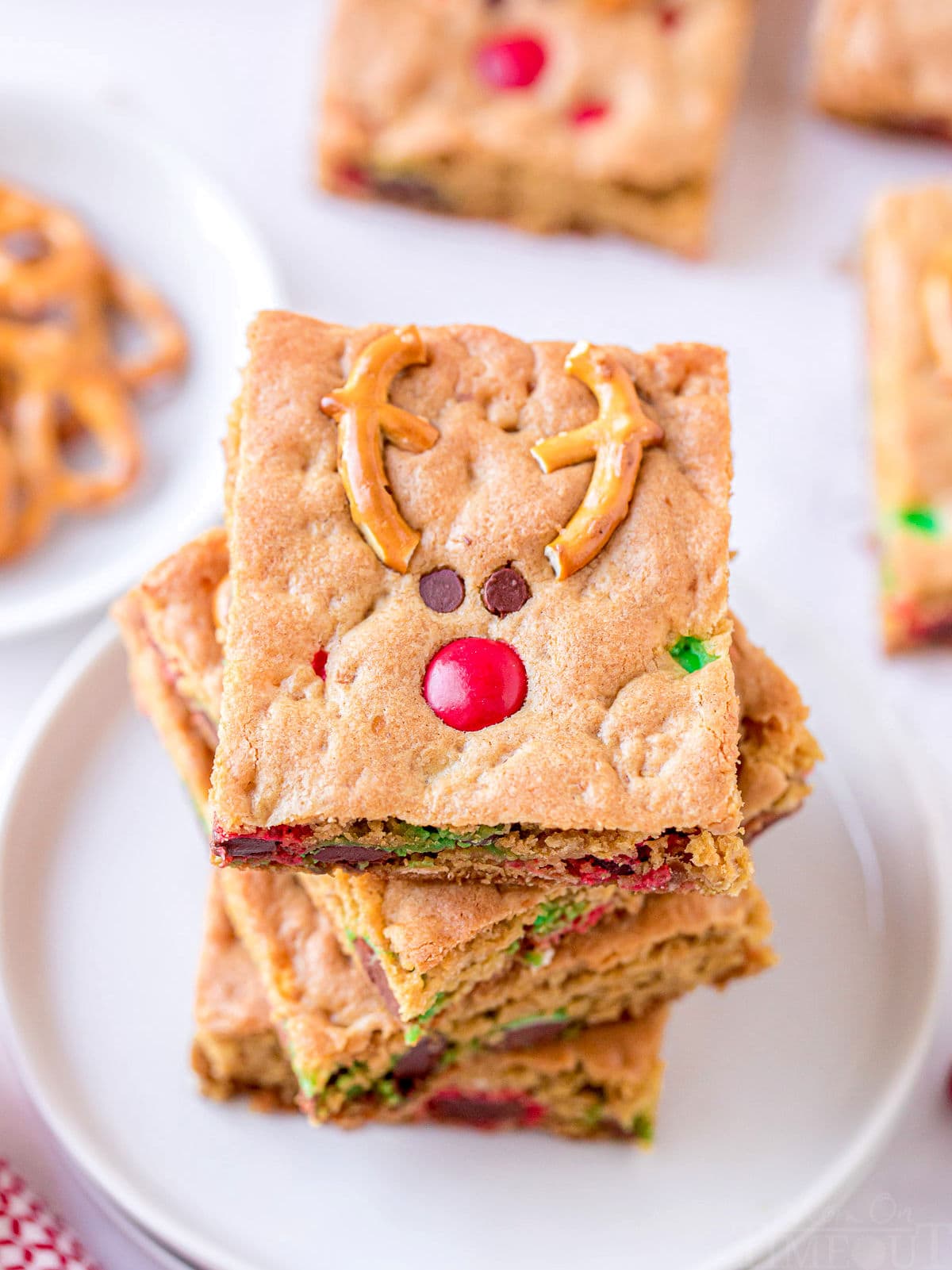 top down view of cookie bars stacked 4 high on a white plate