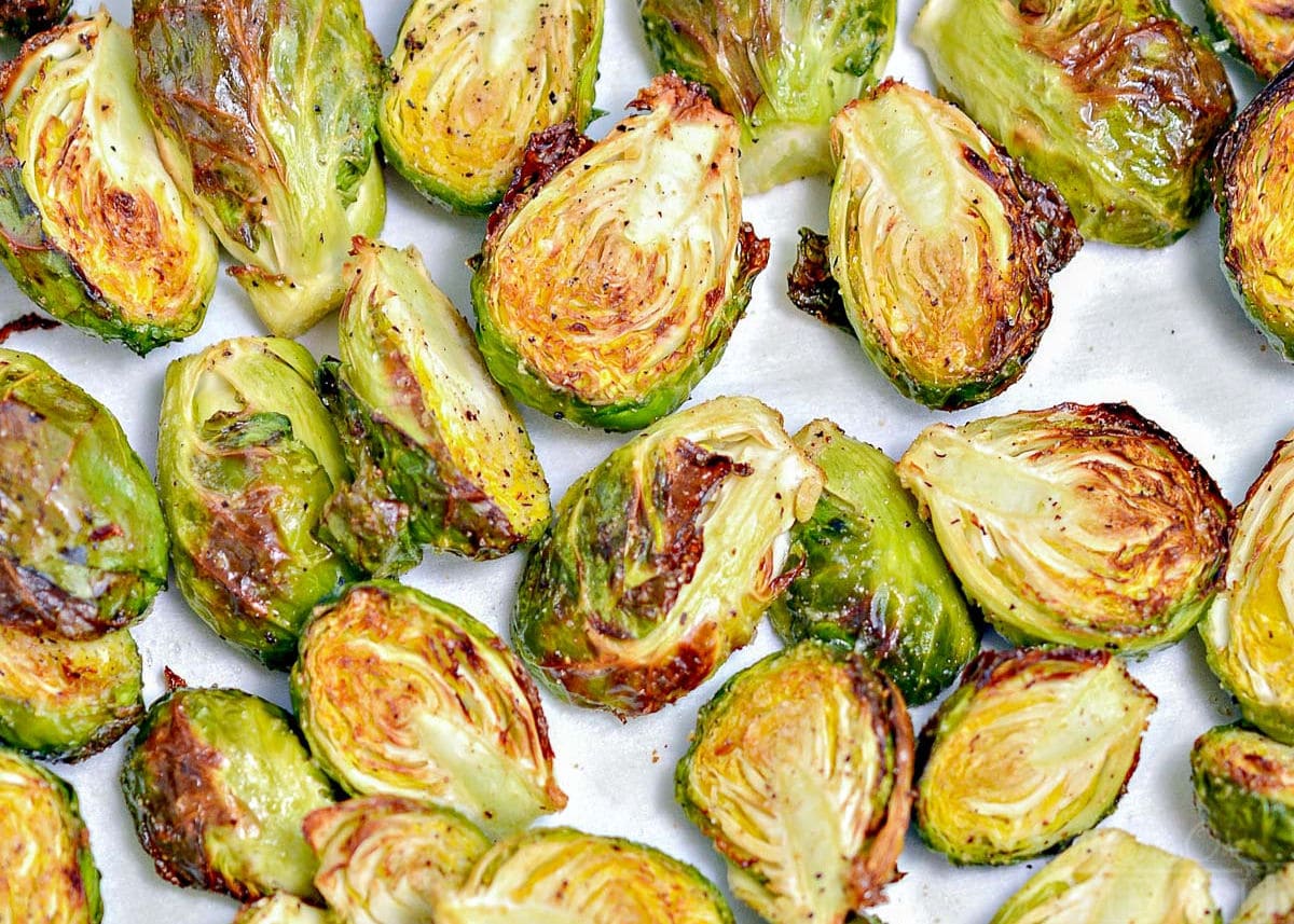 brussel sprouts in air fryer all golden and crispy in a single layer