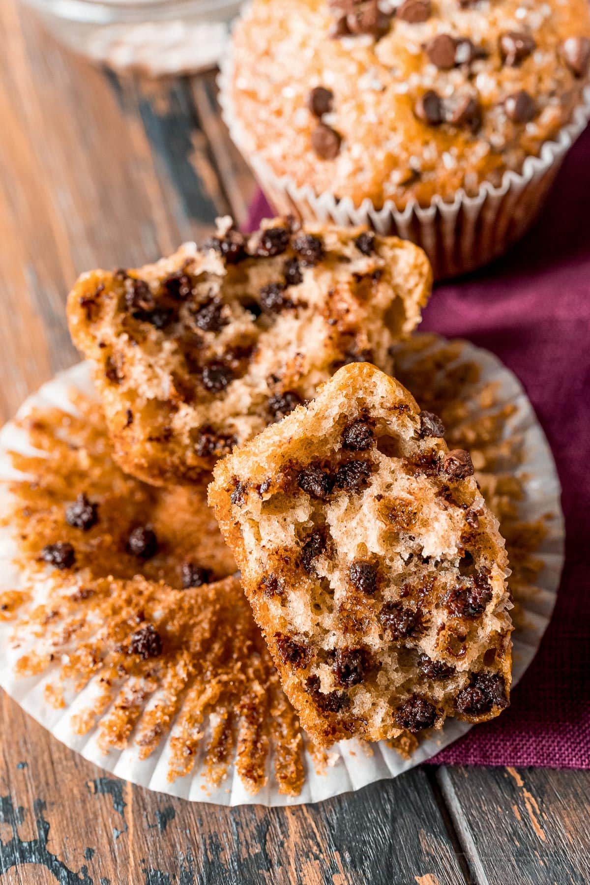 split chocolate chip muffin still in liner