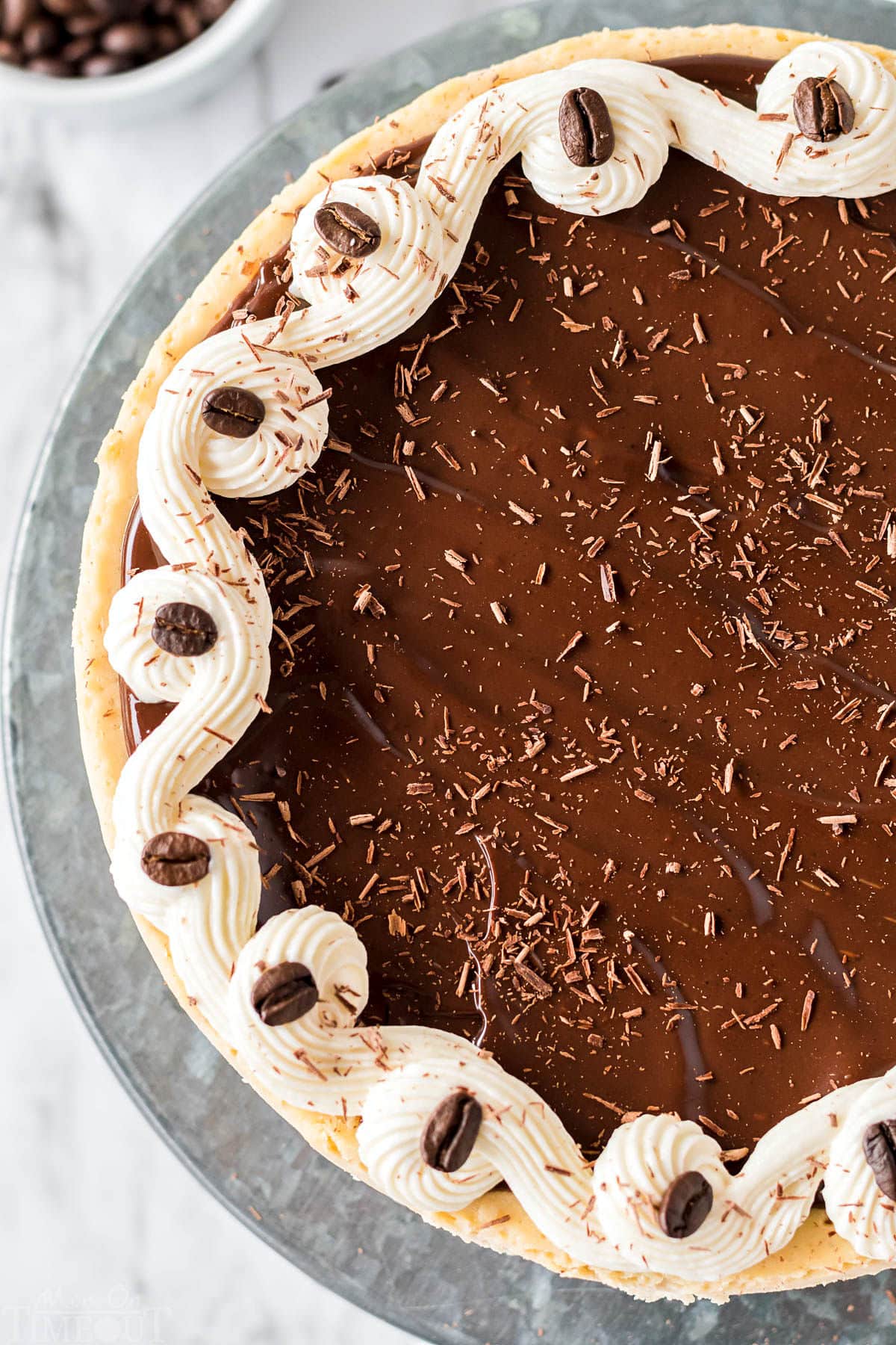 top down look at espresso cheesecake on metal cake stand