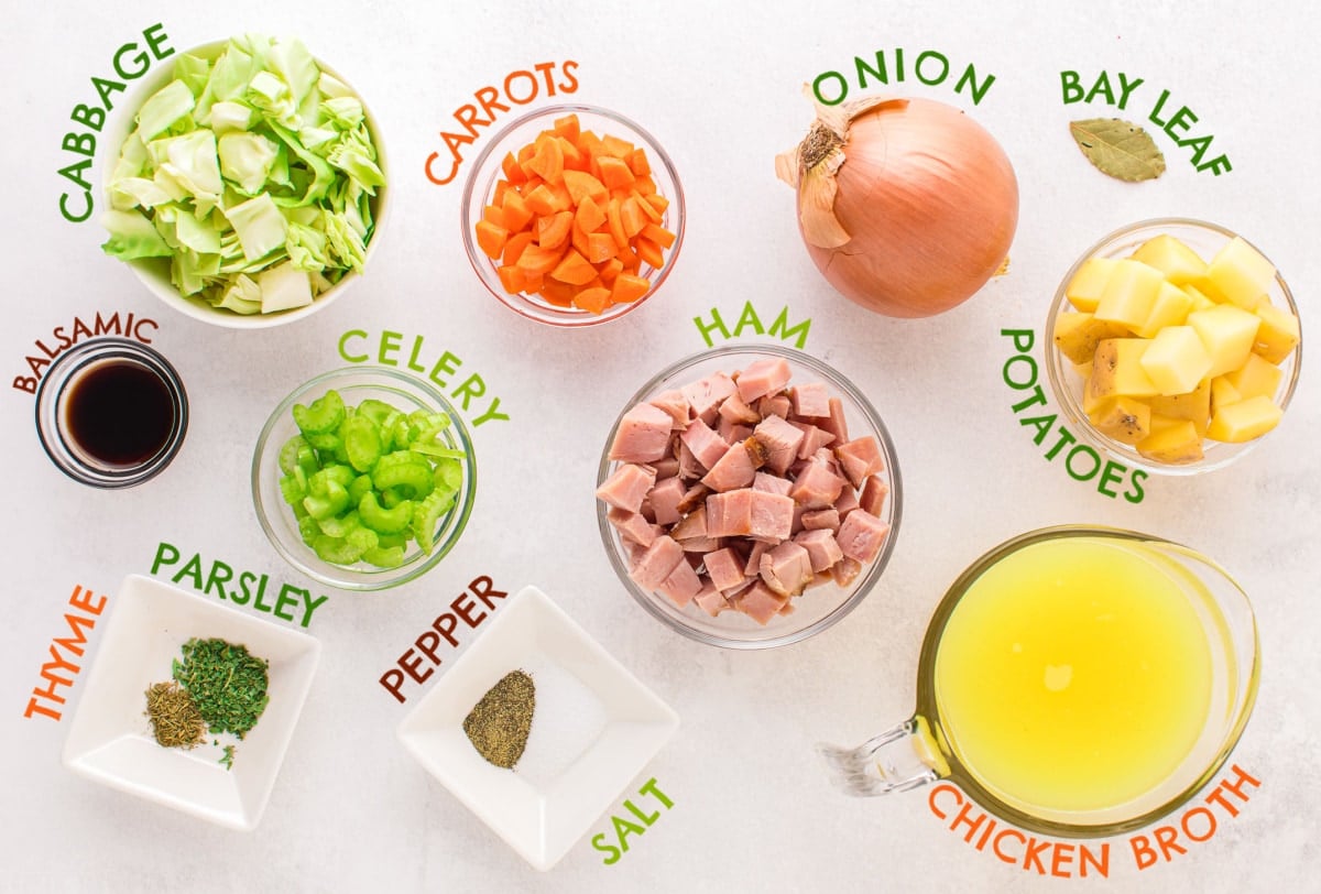 cabbage soup ingredients measured out into small bowls and labeled.