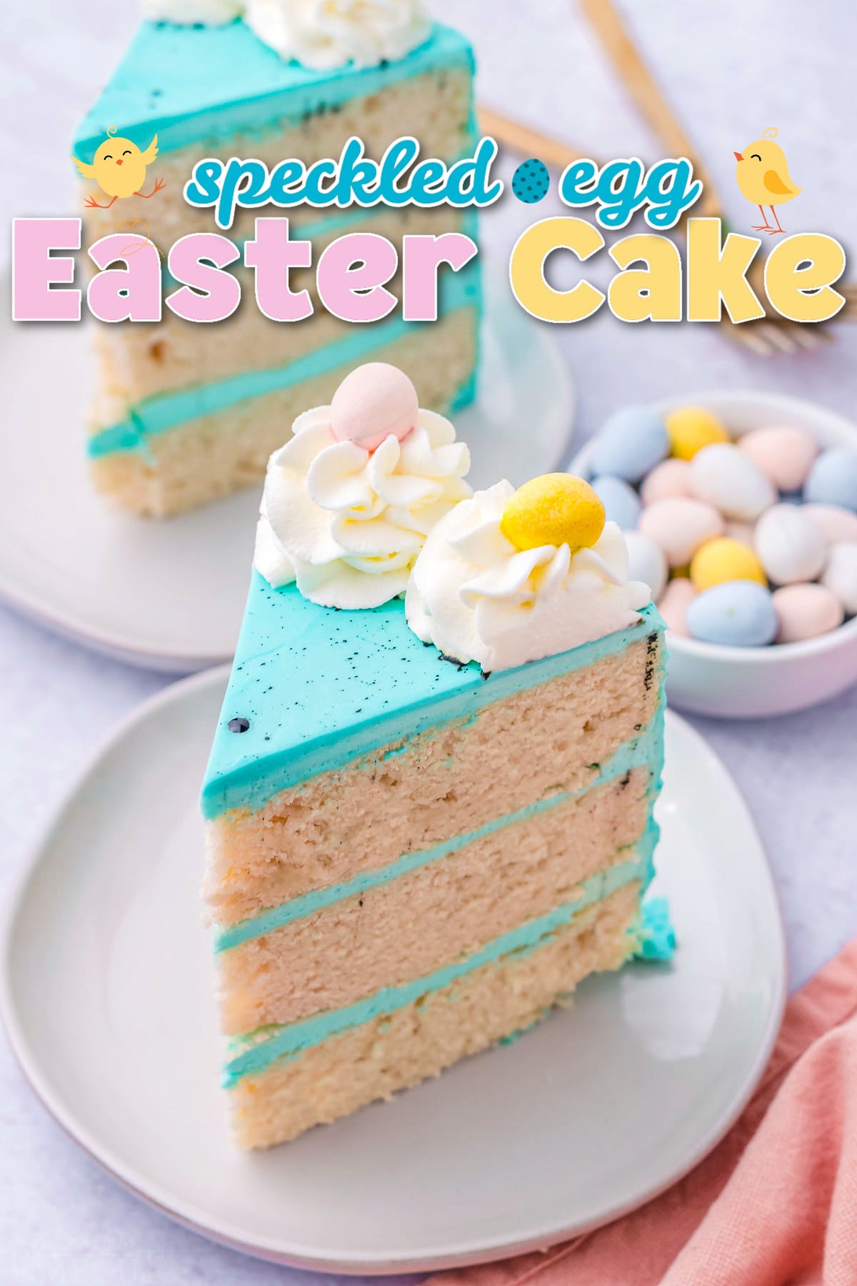 two slices of easter cake with bright blue frosting decorated with cadbury eggs. title overlay at top of image.