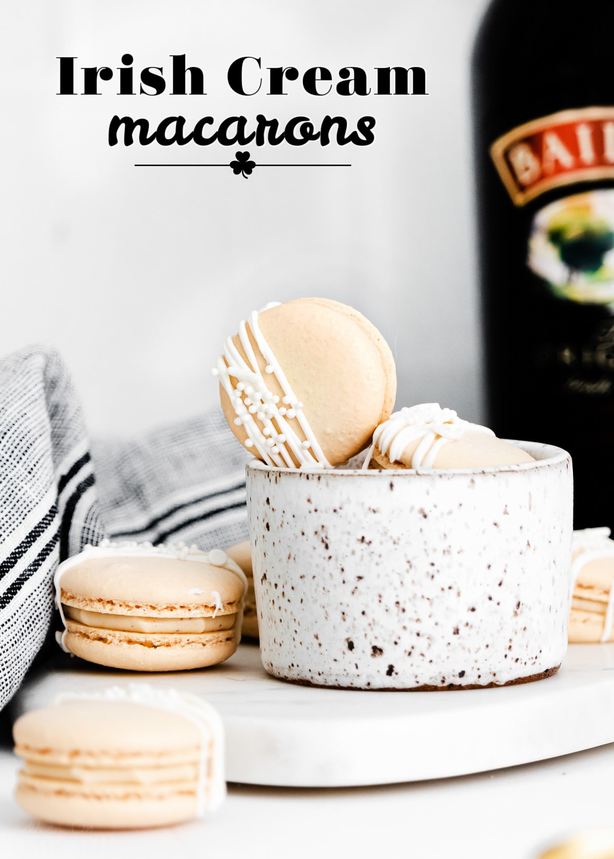 irish cream macarons next to bottle of baileys with title overlay.