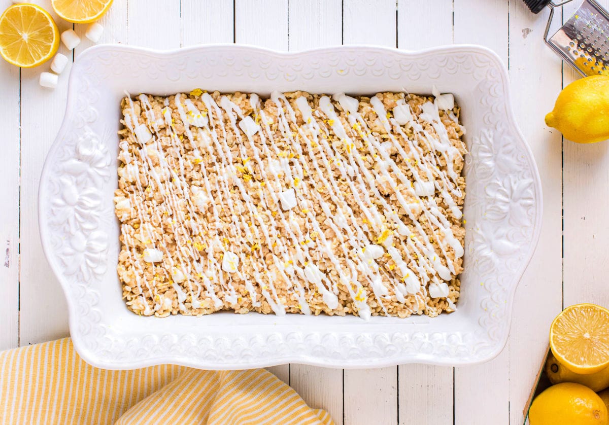 lemon rice krispie treats in white baking dish.