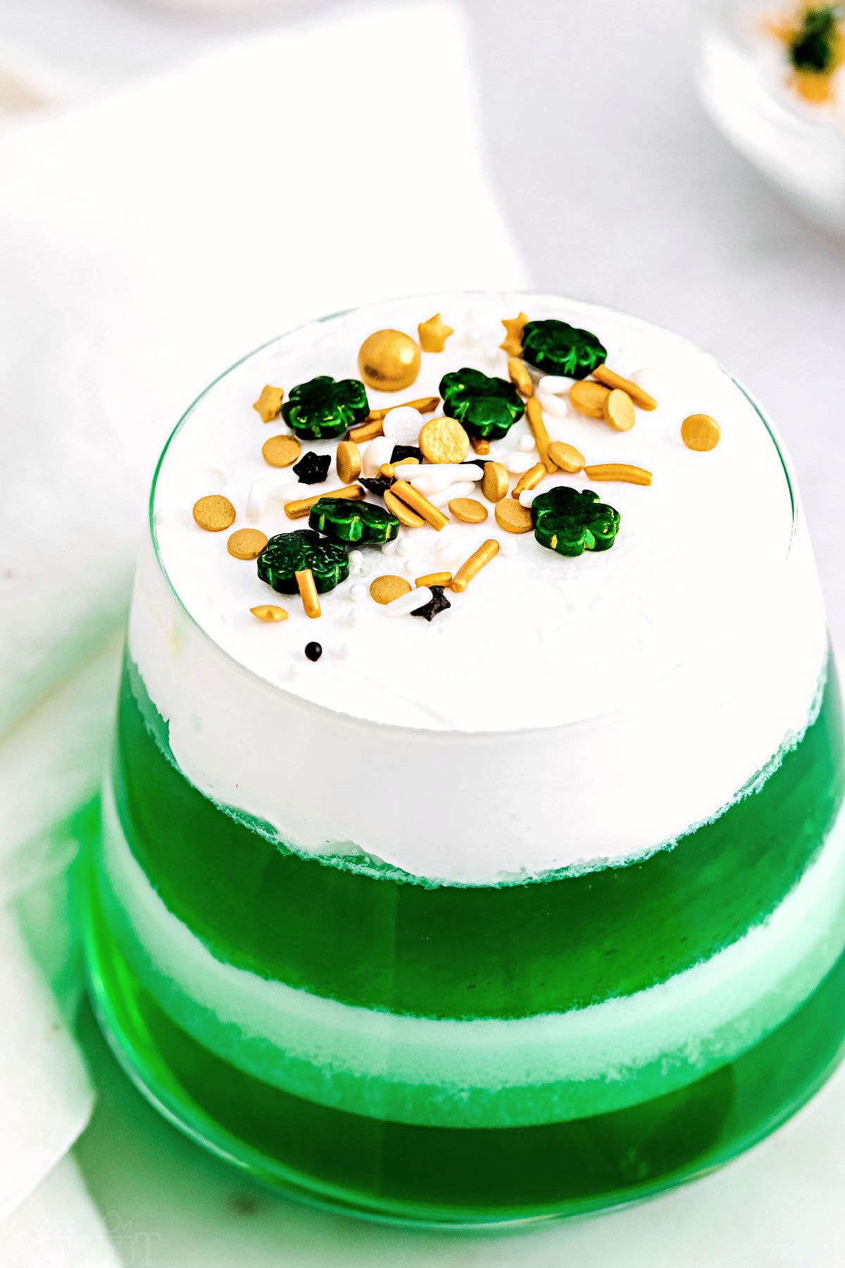 top down view of lime jello layered cups.