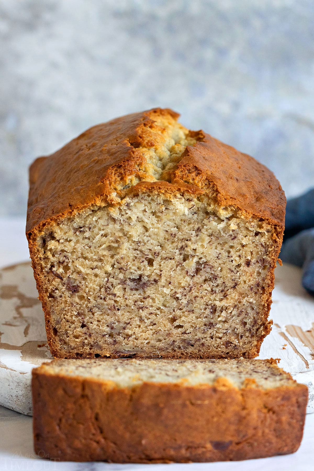 loaf of banana bread with one slice cut.