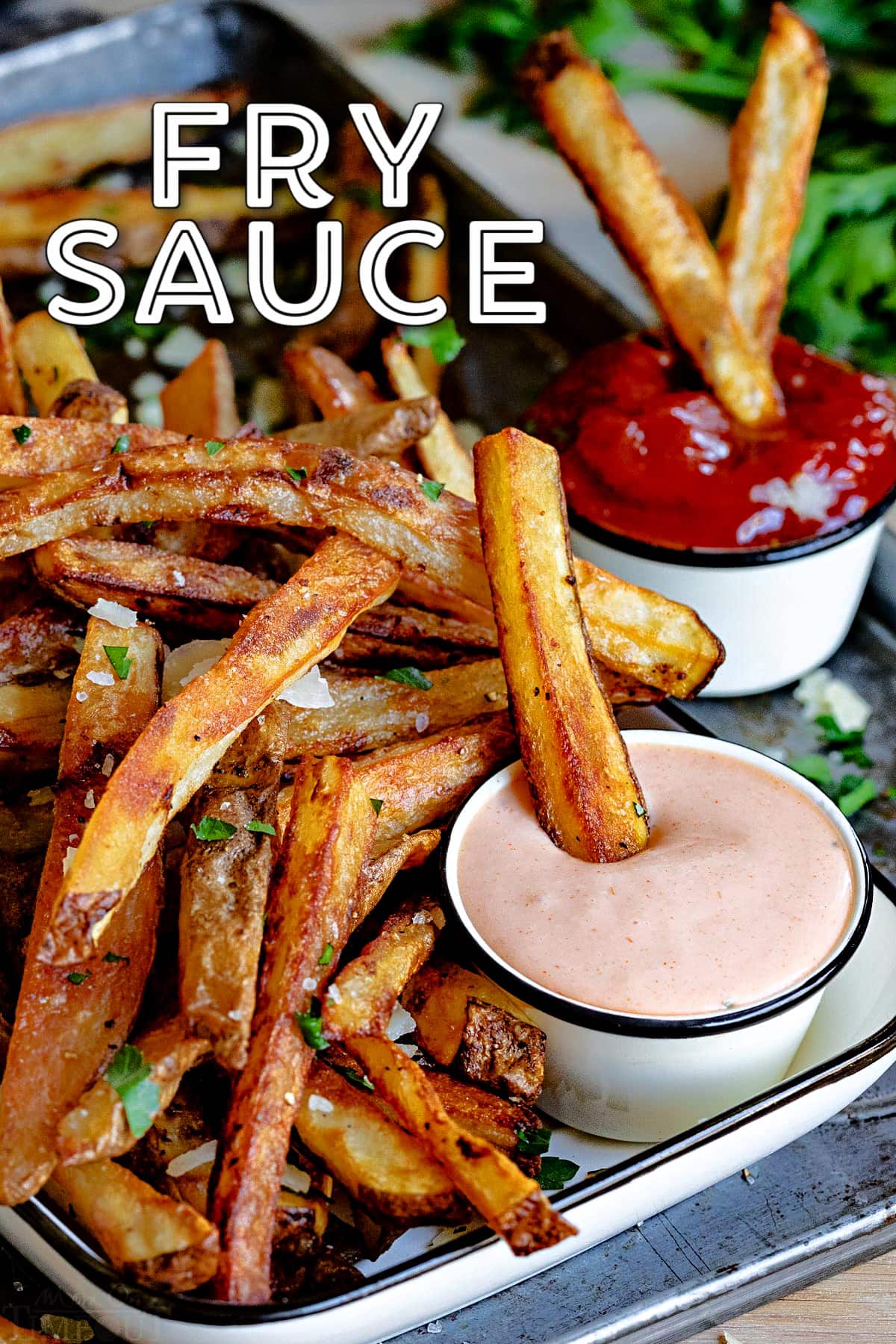 french fries on baking sheet with fry sauce and ketchup and title overlay at top of image.