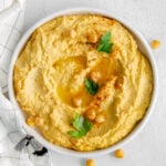 hummus in shallow white bowl.