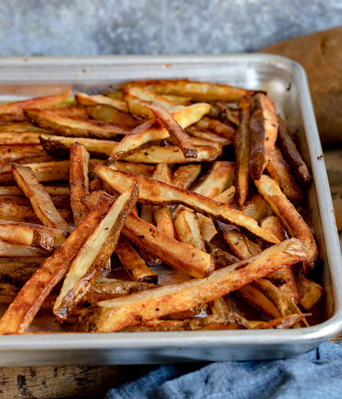 lots of crispy oven fries on baking sheet.