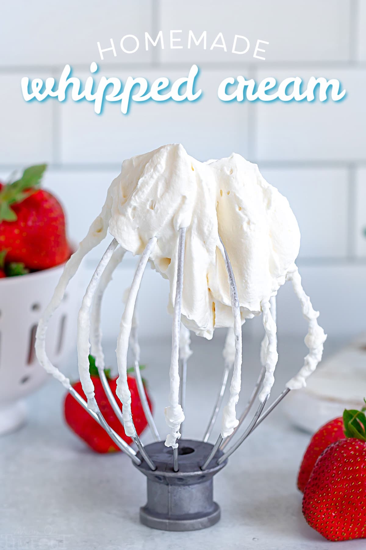 homemade whipped cream on whisk attachment with title overlay at top.