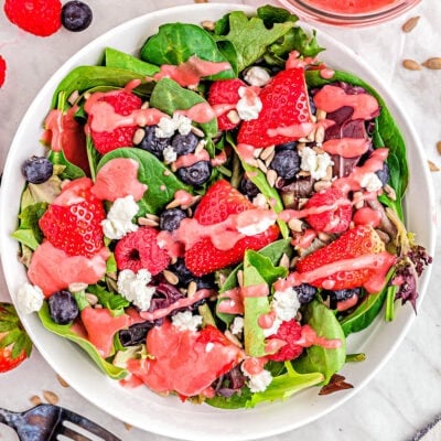 top down view of berry salad with raspberry vinaigrette ready to serve.