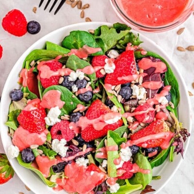 top down view of berry salad with raspberry vinaigrette ready to serve.