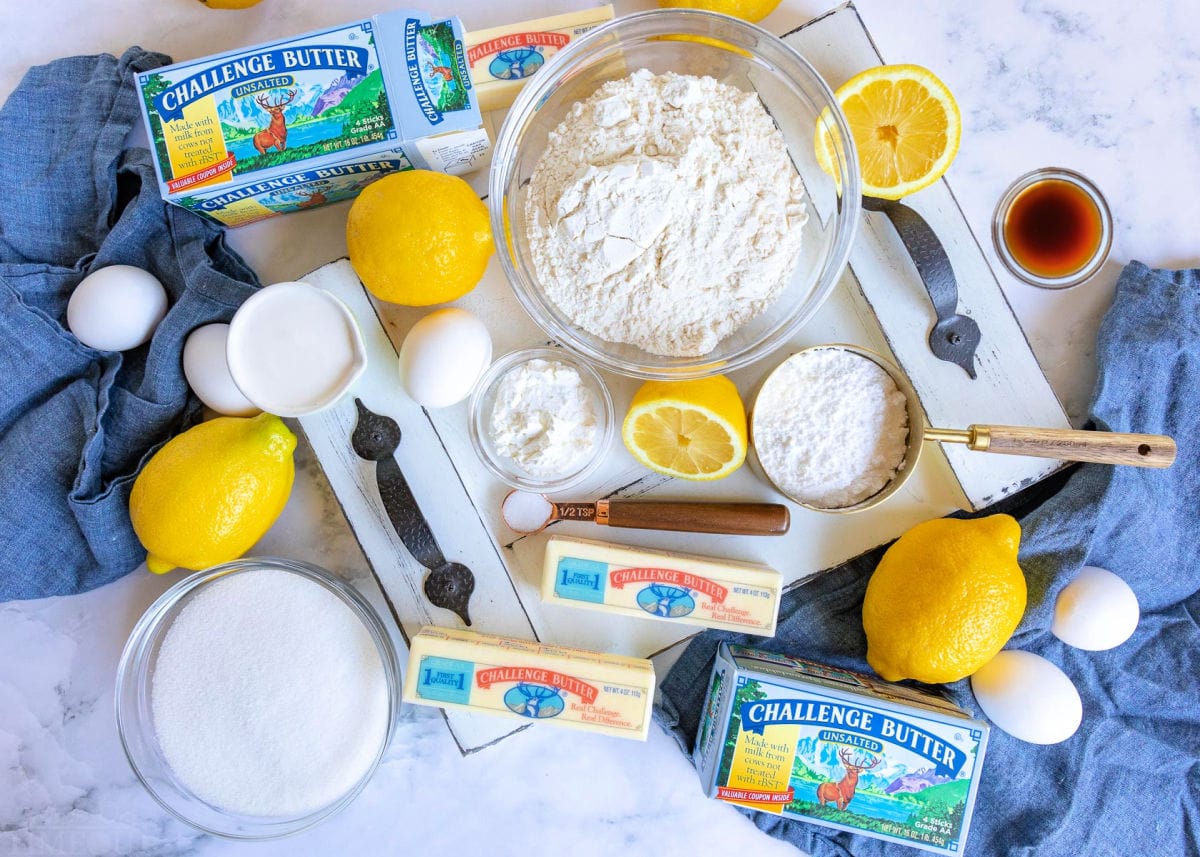 lemon bar ingredients measured out into small bowls.