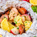 grilled shrimp boil made in foil packets with corn, sausage and shrimp.