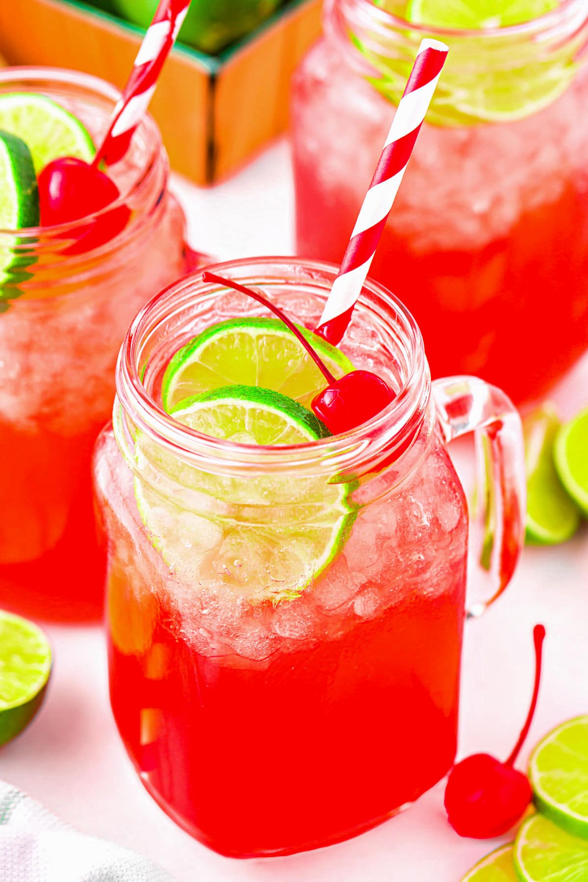 copycat sonic cherry limeade in mason jar glasses ready to serve.