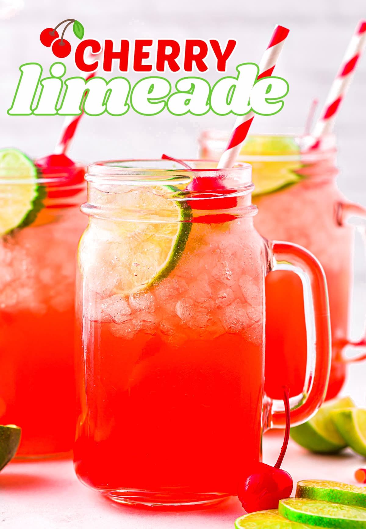 three mason jar glasses filled with cherry limeade and red and white striped paper straws. title overlay at top of image.