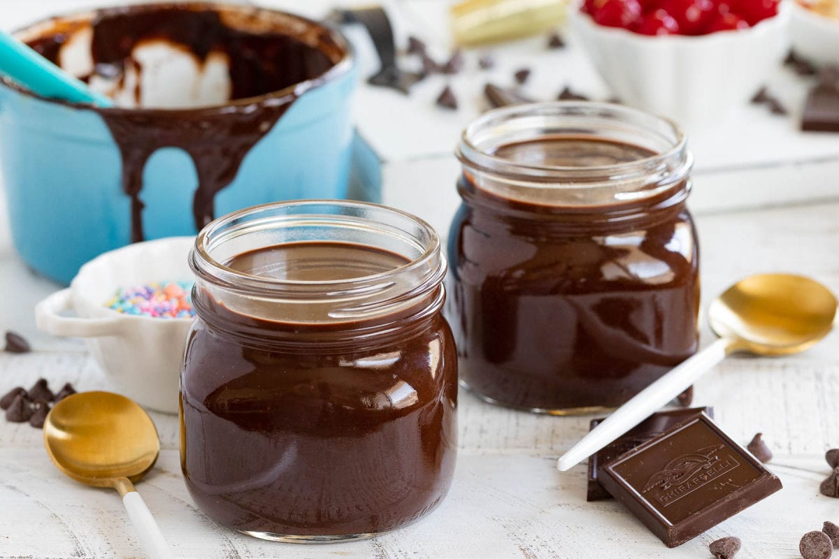 hot fudge made two different ways in small canning jars.