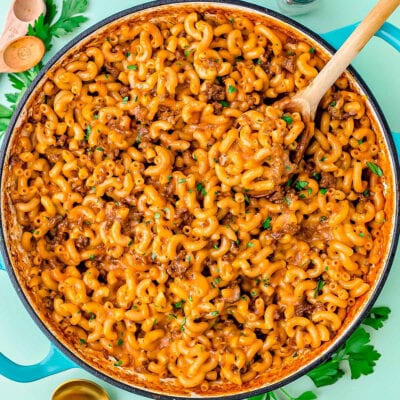 skillet of homemade hamburger helper garnished with chopped fresh parsley.