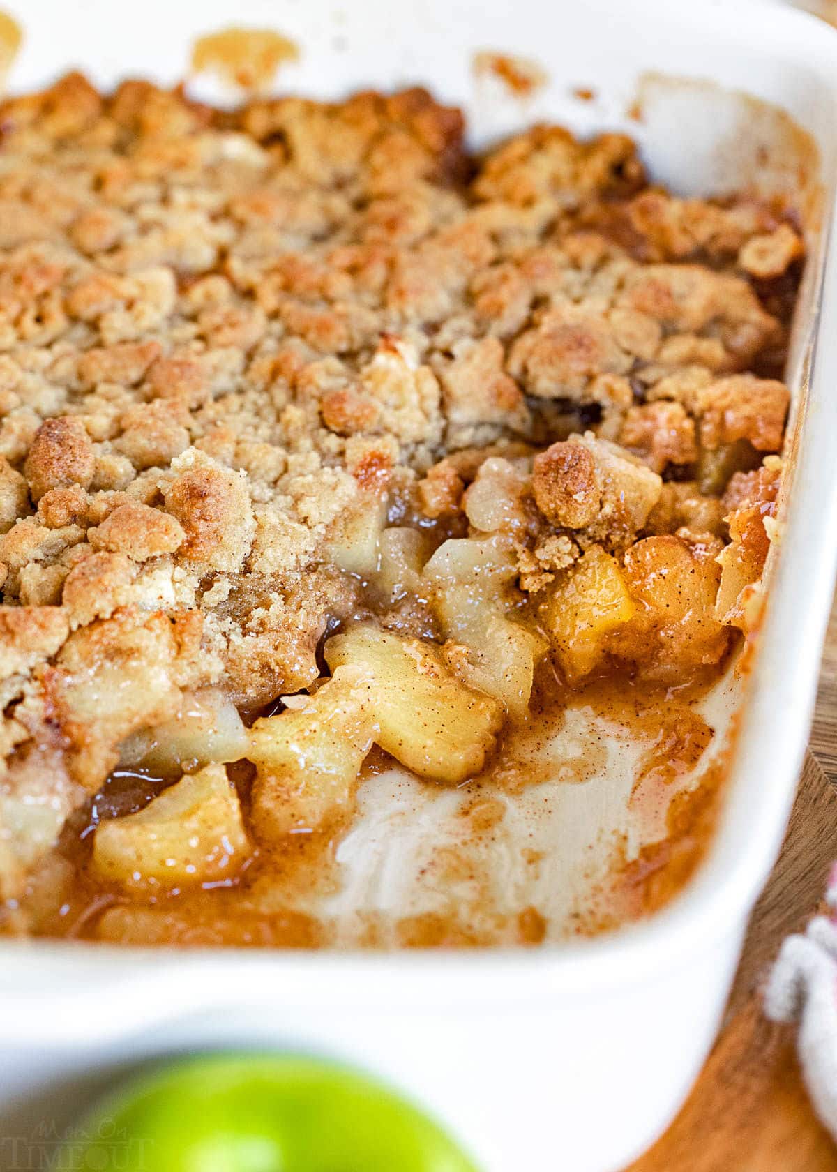 baking dish with a few servings of the apple crumble removed.