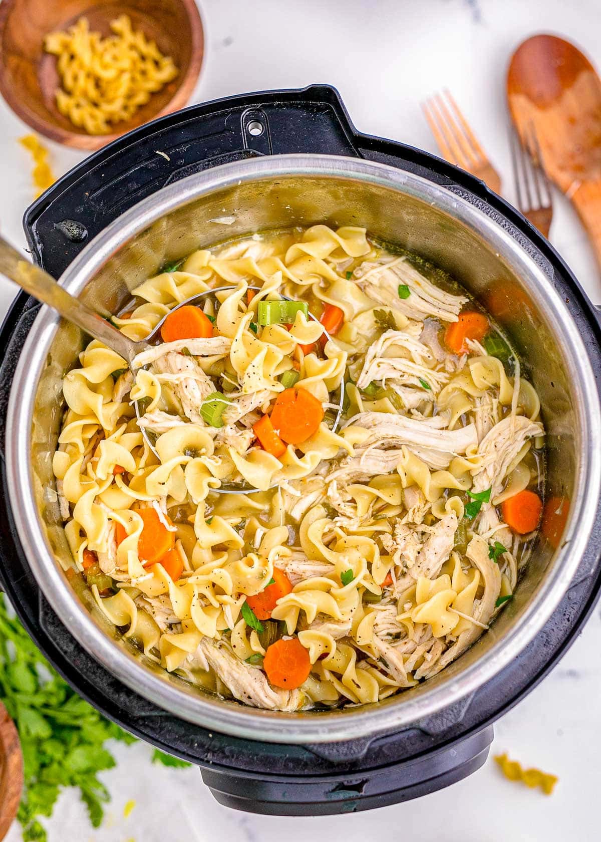 top down look at chicken noodle soup in an instant pot ready to be served.