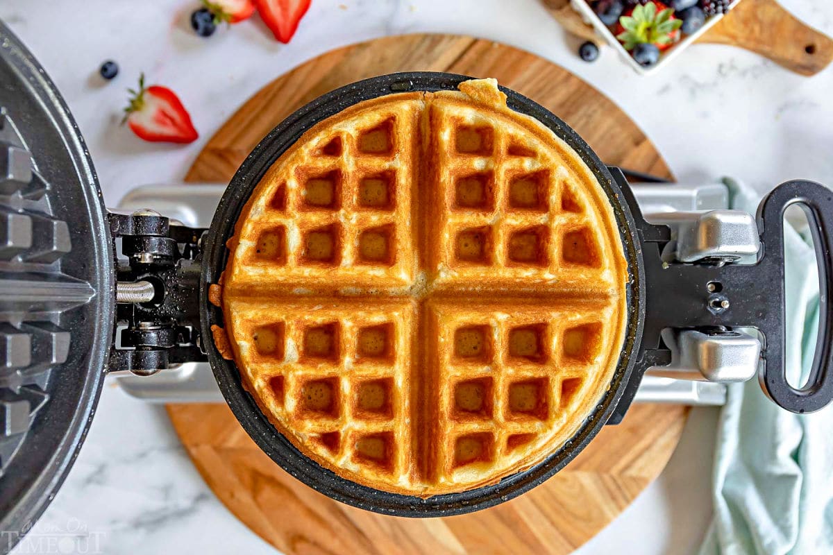 waffle golden and crispy sitting in waffle maker.